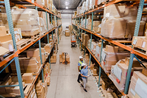 Aerial view of warehouse employees working together to take inventory