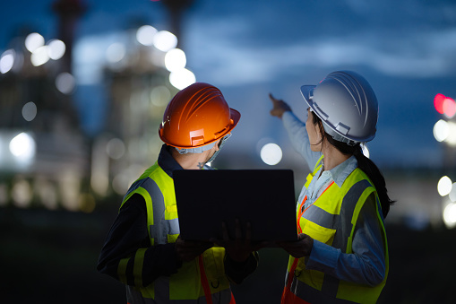 Rear View of Field Support Engineers working in a Power Plant