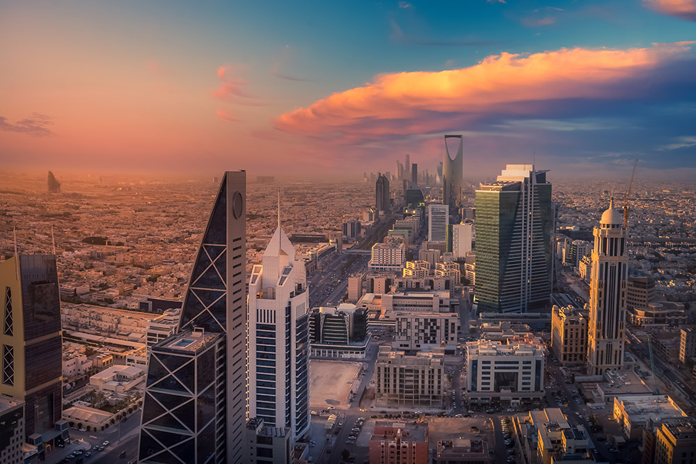 City from above with sunset background