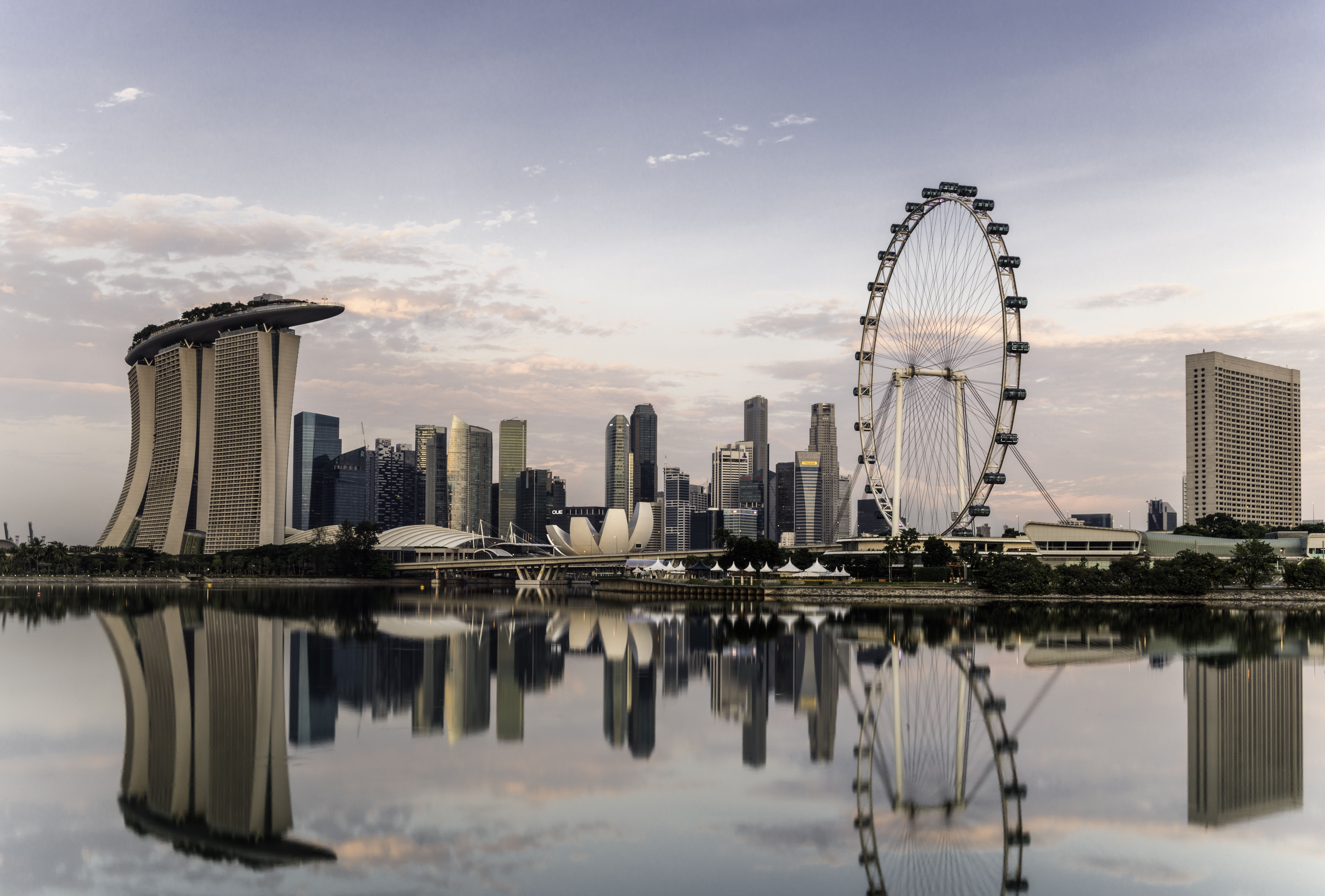 Landscape view from the bay of futuristic buildings with a Ferris wheel